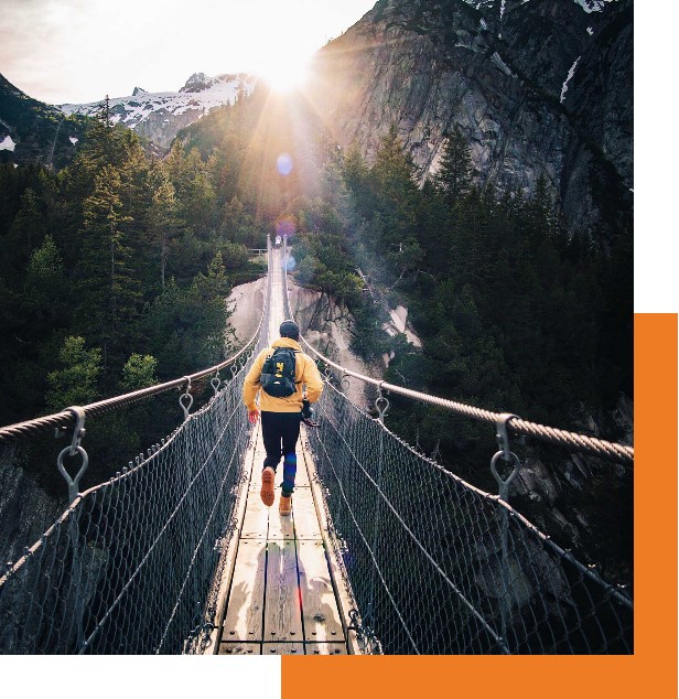 homepage Tier 2 - Persona walking over a chain bridge